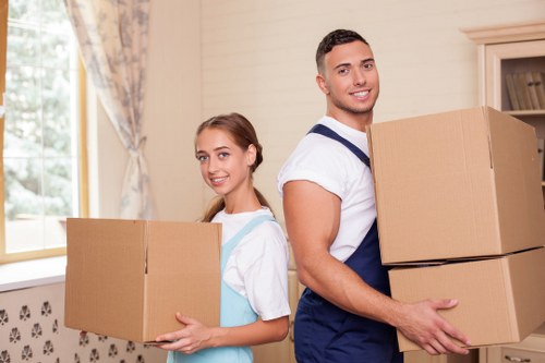 Professional movers handling furniture in Shepherds Bush